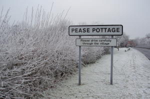 Pease Pottage sign in winter